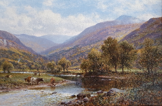 Cattle watering in a river landscape