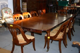 A Good Regency Mahogany Extending Dining Table, retaining it's full compliment of leaves. Circa 1820
